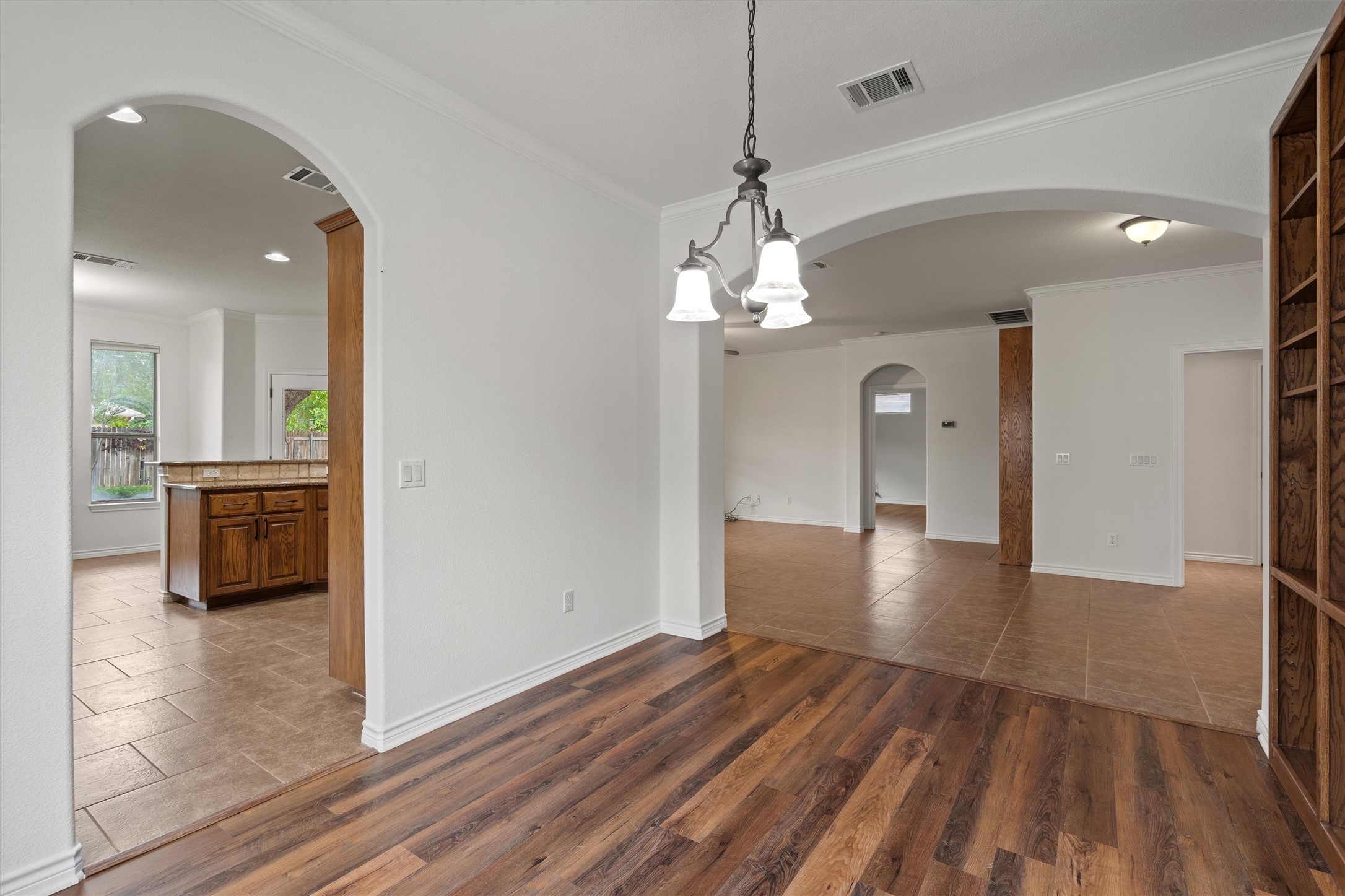 4612 Sonora Trace Georgetown, TX 78633 - Photo 14 of 36 a view of a room with wooden floor and a kitchen