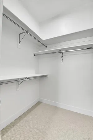 a view of an empty walk in closet