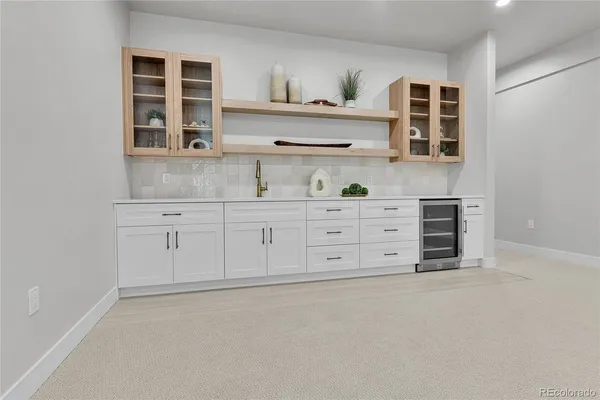 a kitchen with cabinets and window