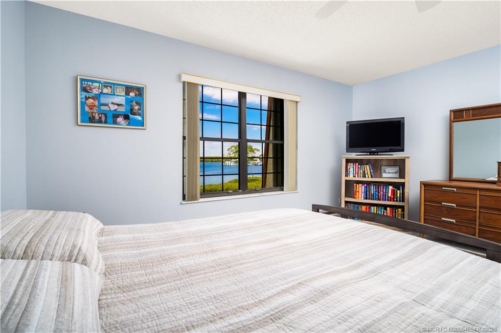 3100 Southeast Pruitt Road, Unit E203 Port St. Lucie, FL 34952 - Photo 17 of 36 New impact windows for this room.