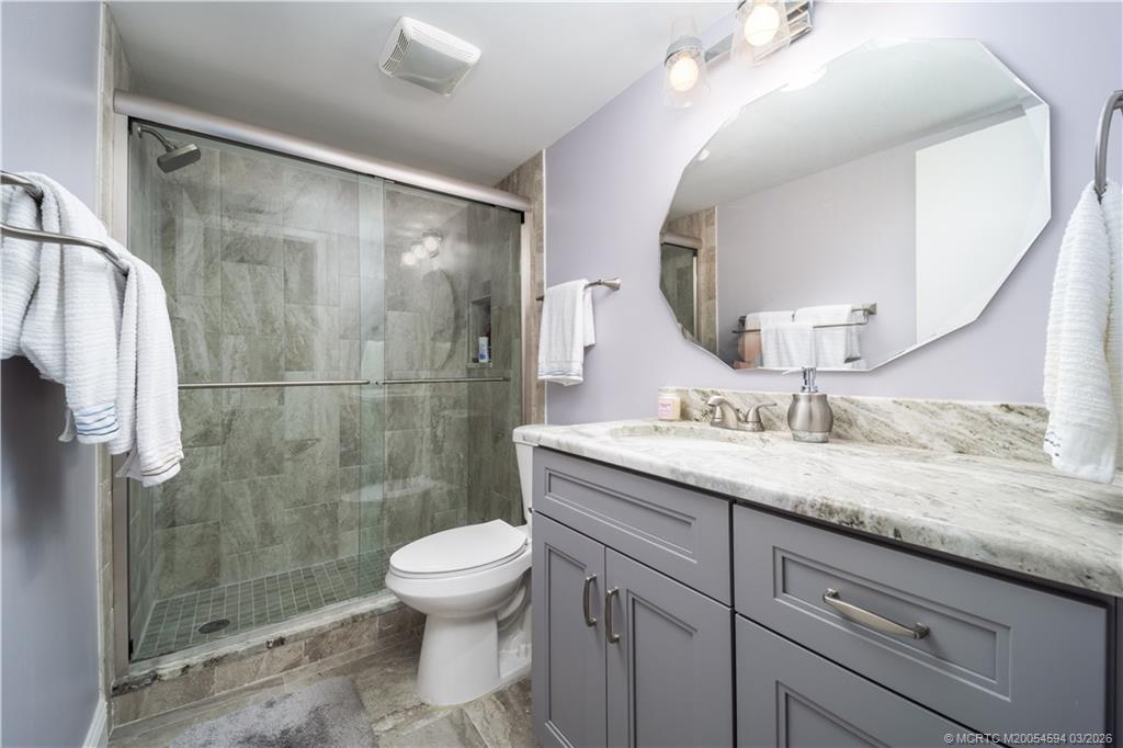 3100 Southeast Pruitt Road, Unit E203 Port St. Lucie, FL 34952 - Photo 24 of 36 Hall bath updated. Tub removed.