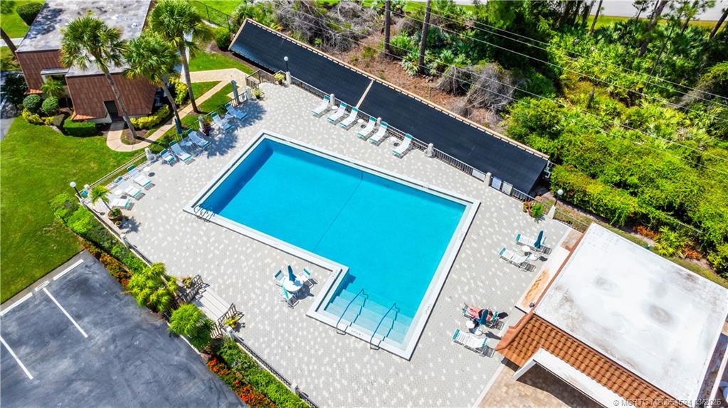 3100 Southeast Pruitt Road, Unit E203 Port St. Lucie, FL 34952 - Photo 27 of 36 Heated pool. Saunas in both cabanas