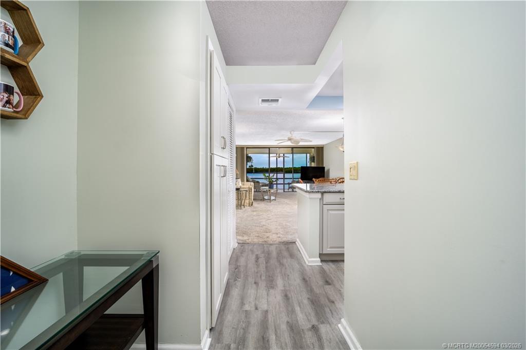 3100 Southeast Pruitt Road, Unit E203 Port St. Lucie, FL 34952 - Photo 5 of 36 Water view from entry to patio