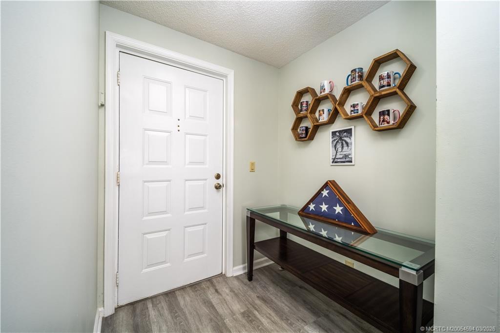 3100 Southeast Pruitt Road, Unit E203 Port St. Lucie, FL 34952 - Photo 6 of 36 Engineered wood flooring