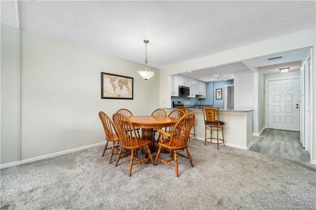 3100 Southeast Pruitt Road, Unit E203 Port St. Lucie, FL 34952 - Photo 8 of 36 Table or counter dining