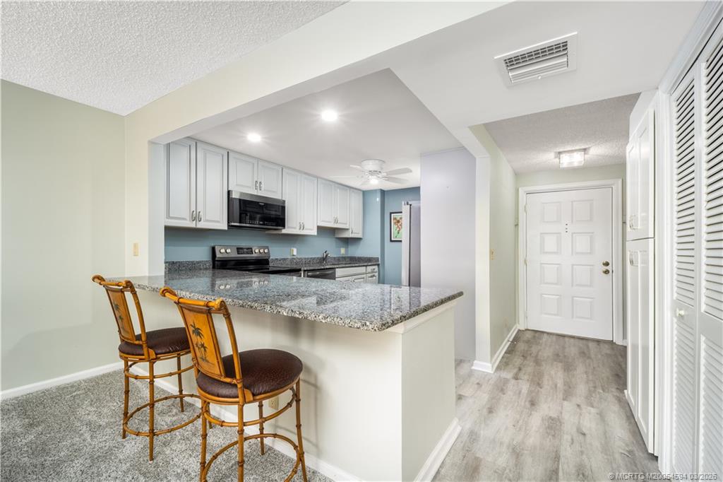 3100 Southeast Pruitt Road, Unit E203 Port St. Lucie, FL 34952 - Photo 10 of 36 Recessed lighting.