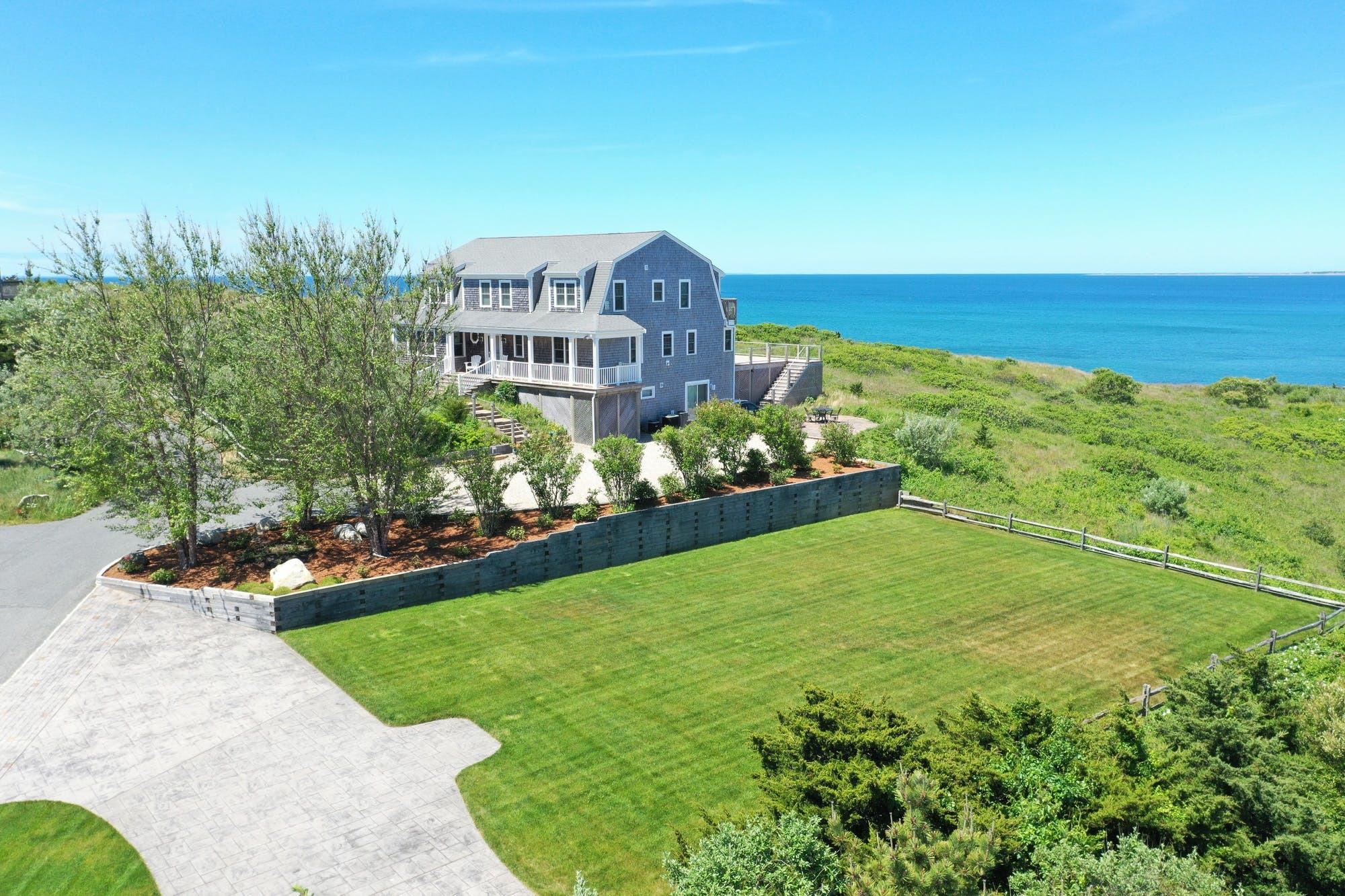 3 Marys Way Truro, MA 02666 - Photo 1 of 37 a view of a house with a big yard and potted plants