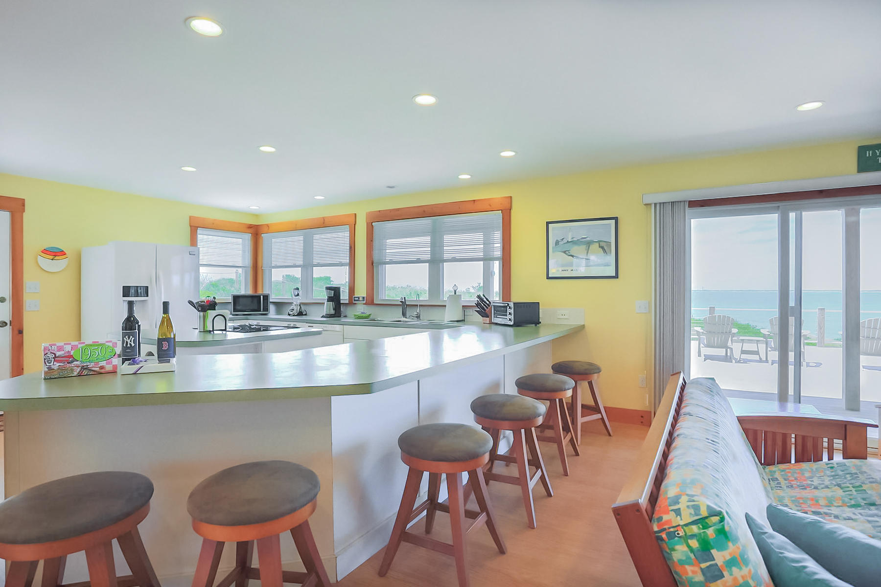 3 Marys Way Truro, MA 02666 - Photo 12 of 37 a dining room with stainless steel appliances granite countertop a table and chairs