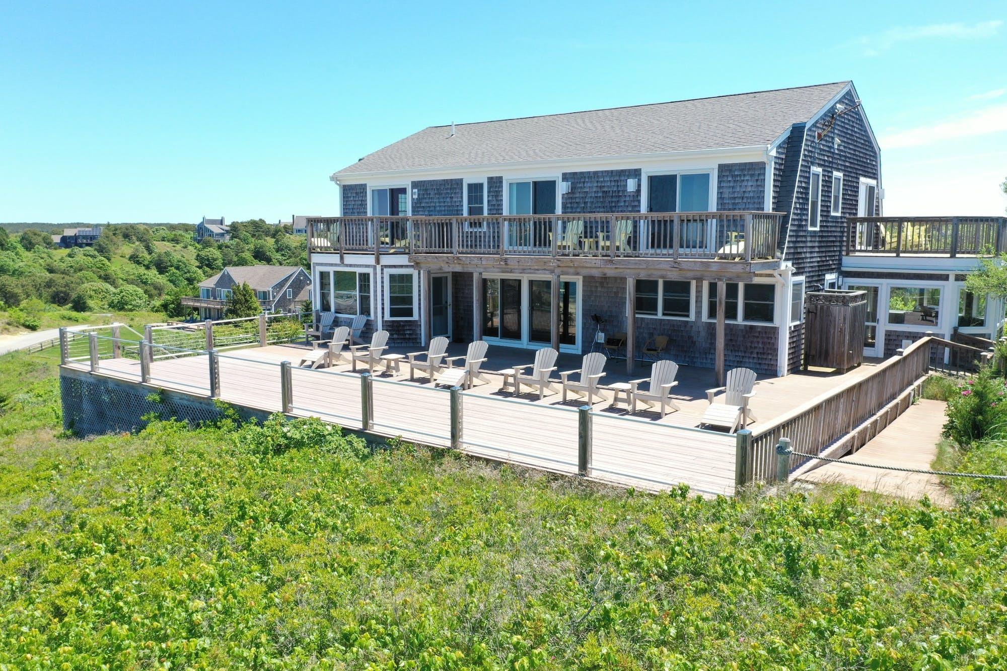 3 Marys Way Truro, MA 02666 - Photo 17 of 37 a view of a building with a garden and sitting area