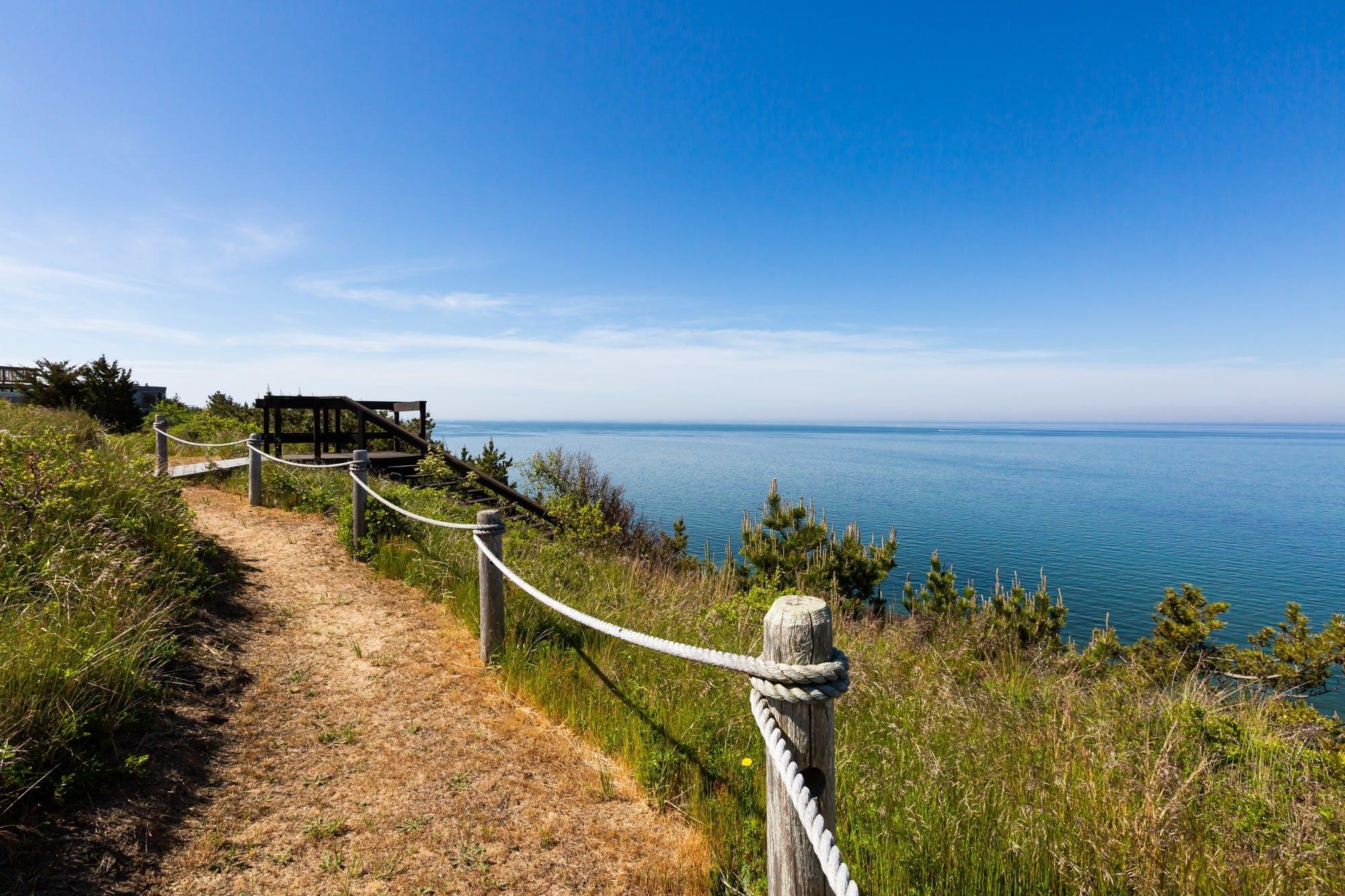 3 Marys Way Truro, MA 02666 - Photo 22 of 37 a view of a lake with a building in the background