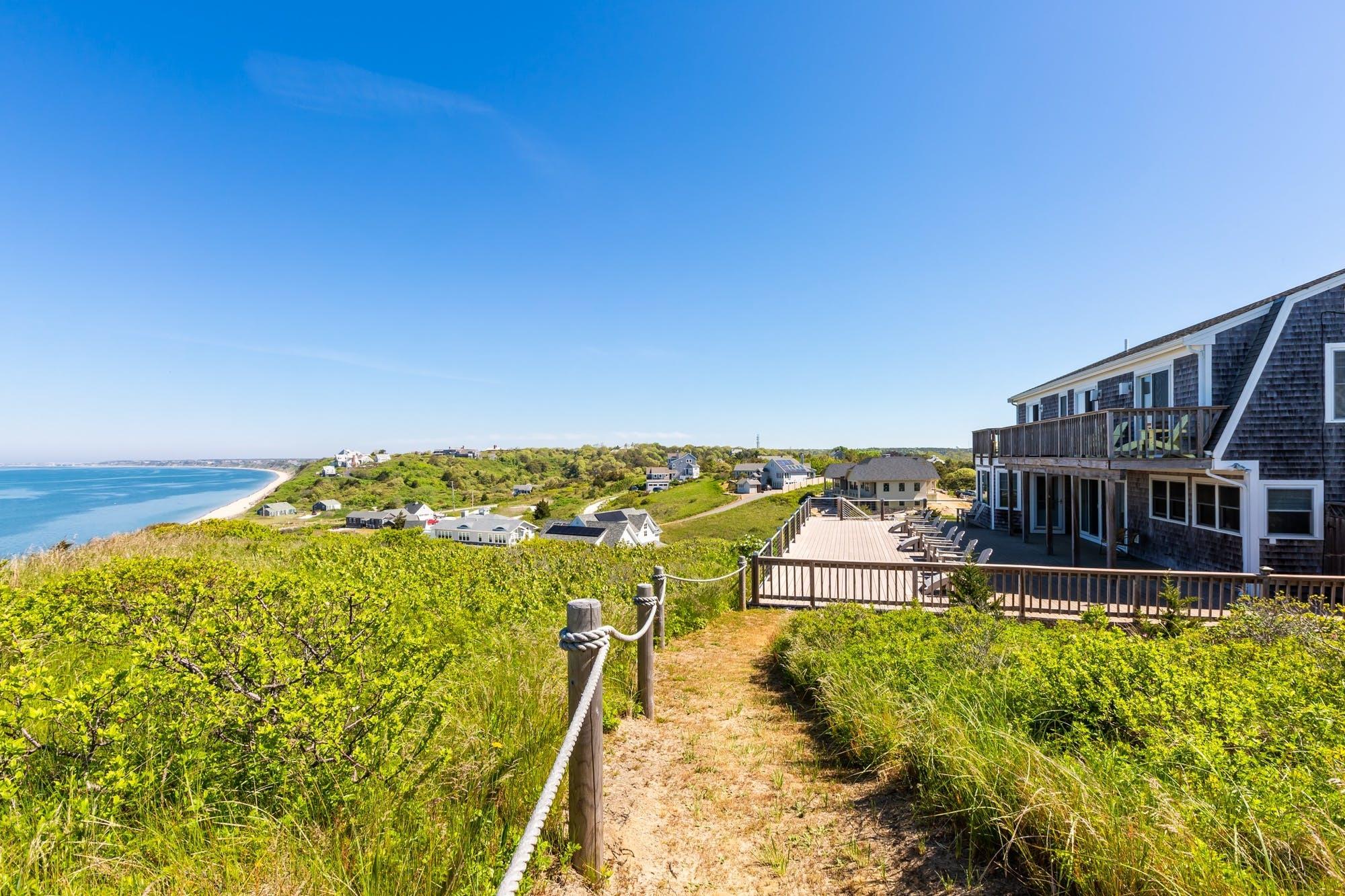 3 Marys Way Truro, MA 02666 - Photo 23 of 37 a view of a swimming pool with an ocean view