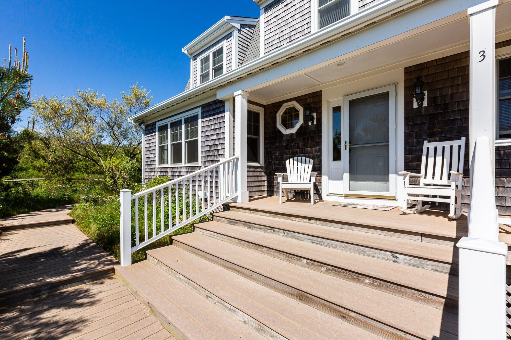 3 Marys Way Truro, MA 02666 - Photo 6 of 37 a view of a house with entrance stairs and a garden