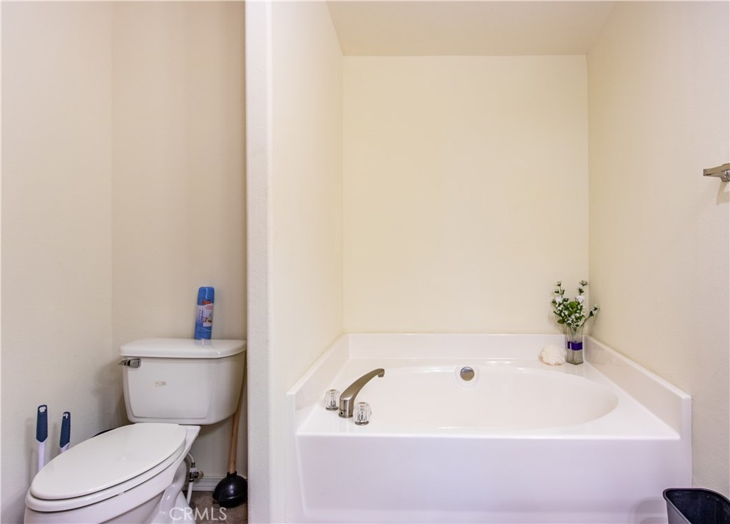 5038 Oak Road Midpines, CA 95345 - Photo 20 of 53 a white bath tub sitting next to a white toilet