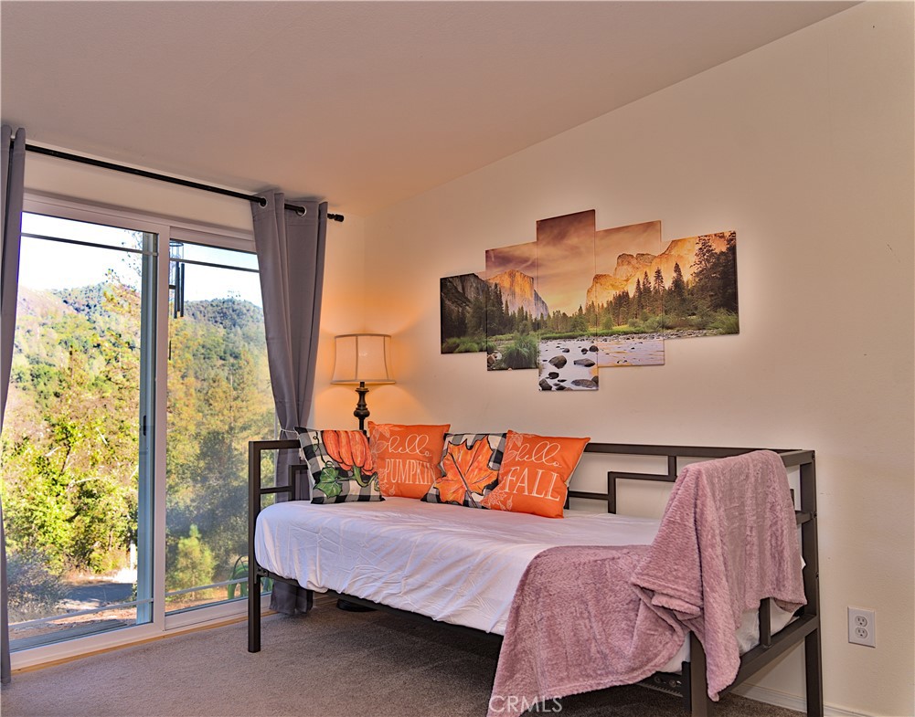 5038 Oak Road Midpines, CA 95345 - Photo 2 of 53 a bedroom with a bed and window