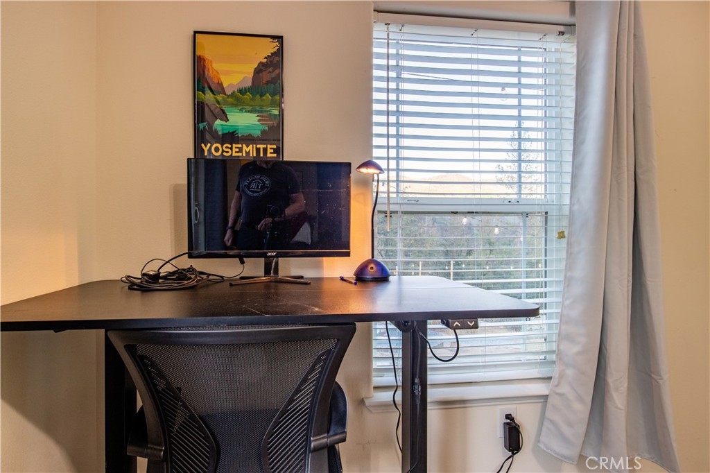 5038 Oak Road Midpines, CA 95345 - Photo 23 of 53 a view of a workspace with furniture and a window