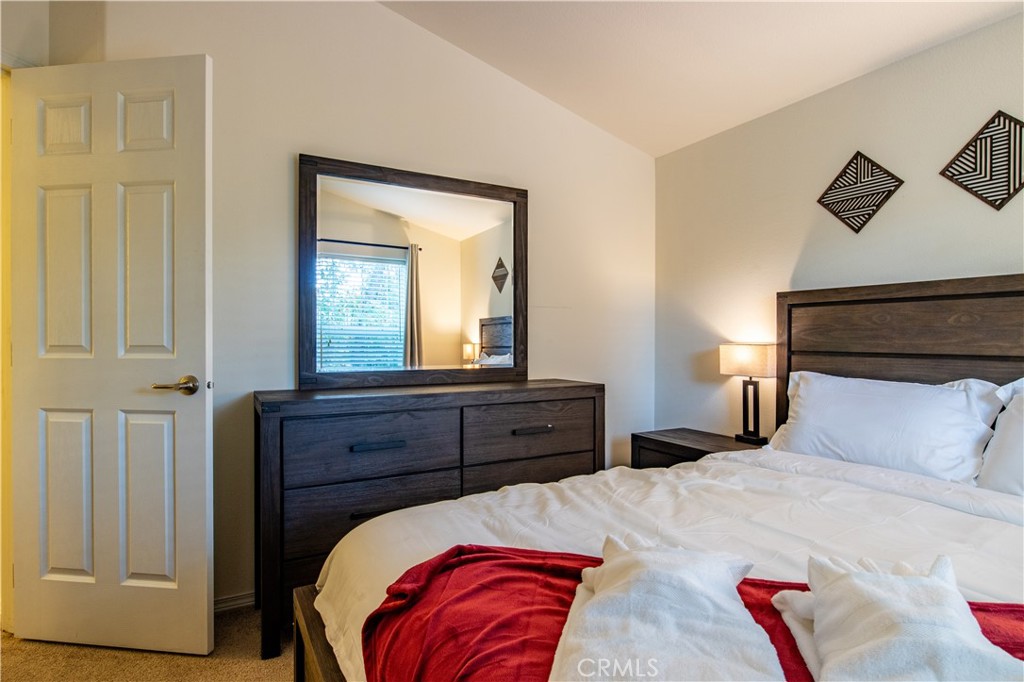 5038 Oak Road Midpines, CA 95345 - Photo 25 of 53 a bedroom with a bed and a mirror on dresser