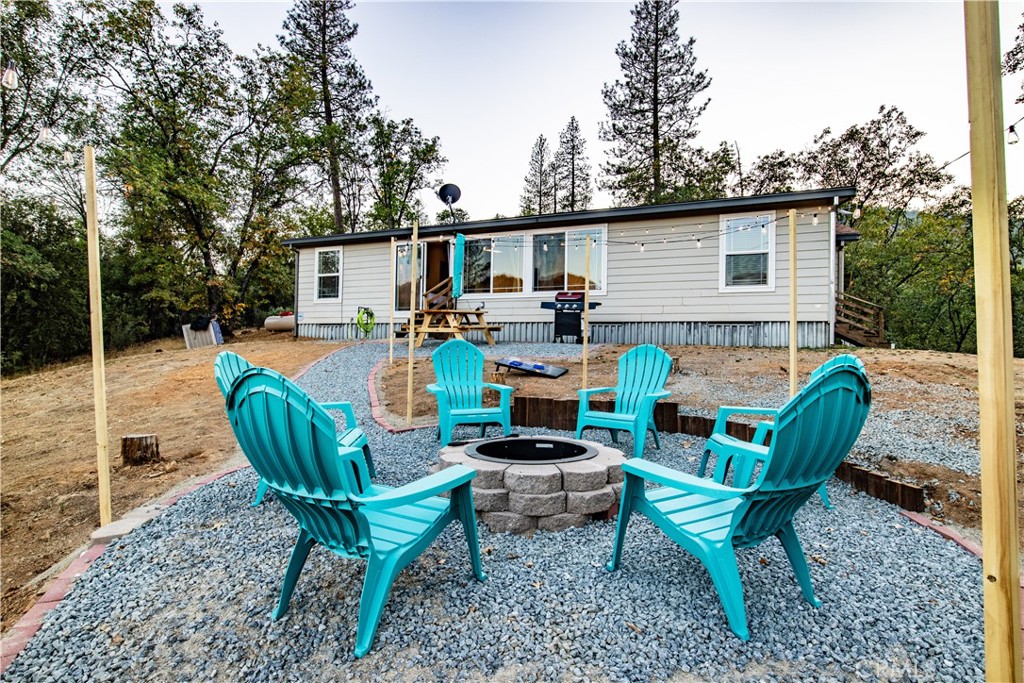 5038 Oak Road Midpines, CA 95345 - Photo 37 of 53 a view of a house with backyard and sitting area