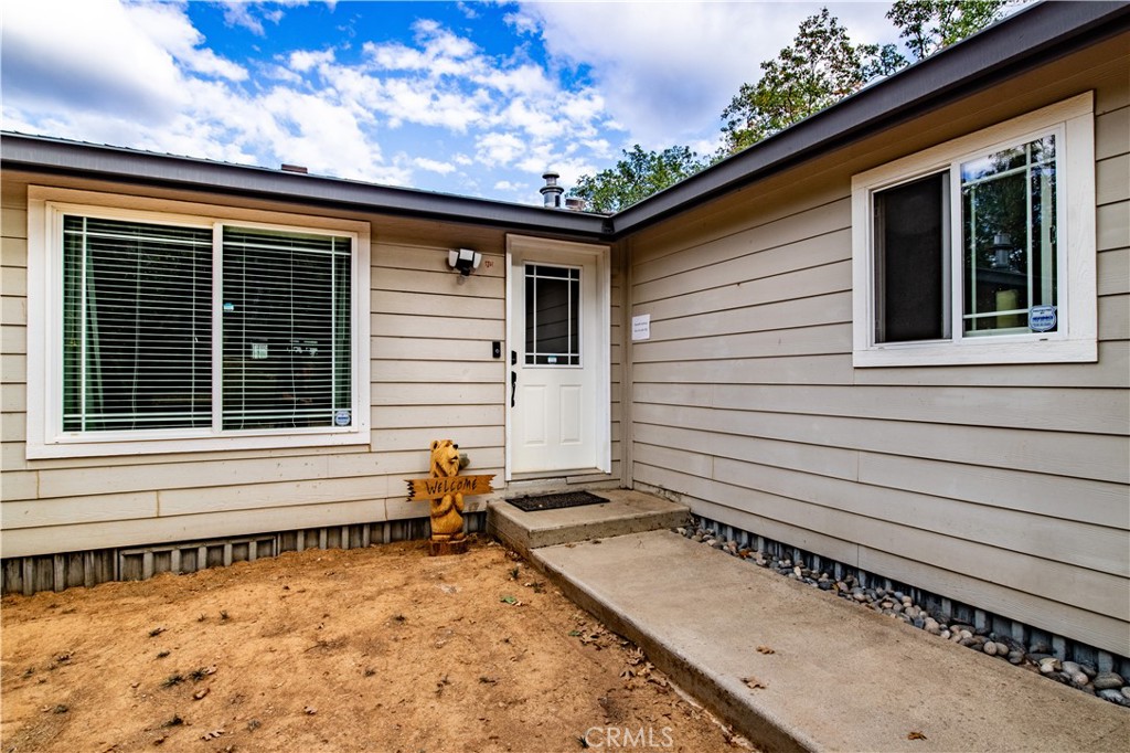 5038 Oak Road Midpines, CA 95345 - Photo 9 of 53 a view of a house with a wooden deck