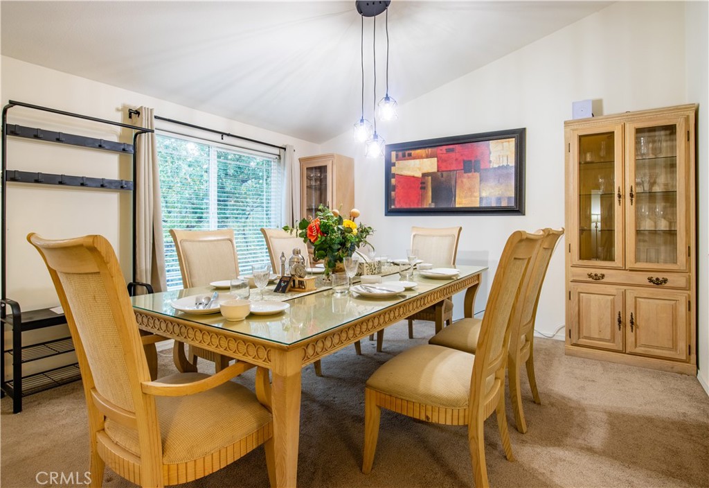 5038 Oak Road Midpines, CA 95345 - Photo 10 of 53 a view of a dining room with furniture wooden floor and chandelier