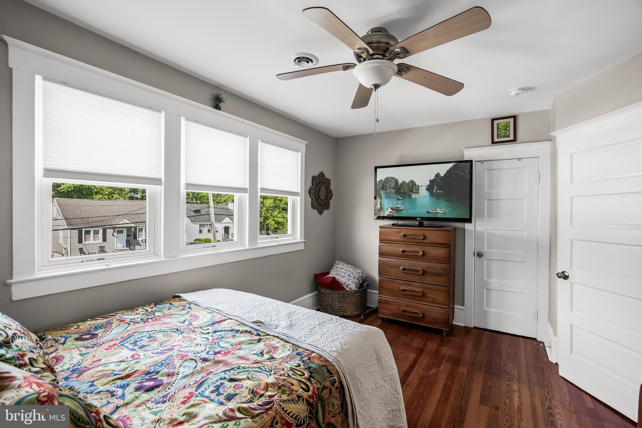 615 North Walnut Avenue Magnolia, NJ 08049 - Photo 21 of 40 a bedroom with a bed dresser and a window