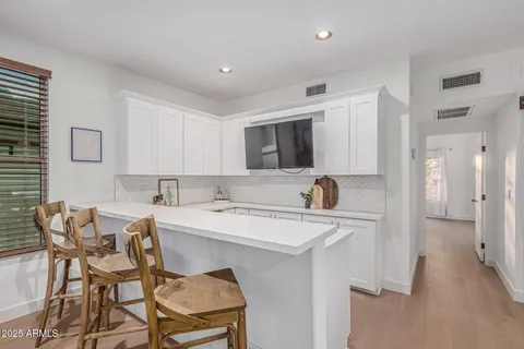 a kitchen with a sink stove and refrigerator