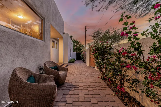 a living room with furniture and a lamp