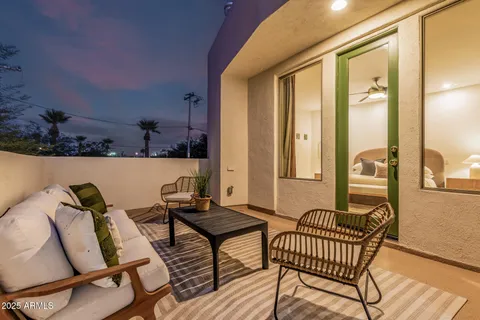 a outdoor living space with furniture and a potted plant