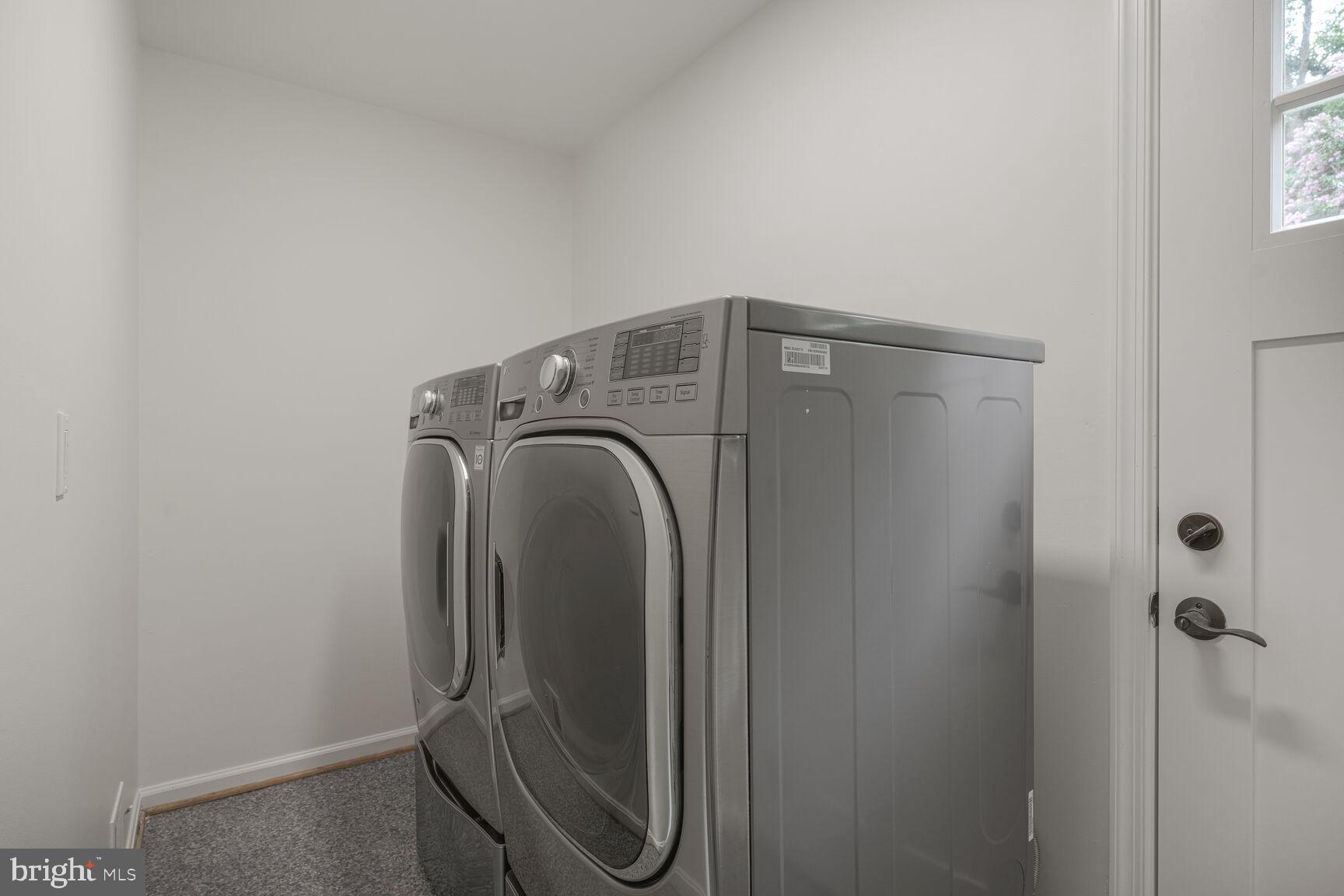 9102 Jones Mill Road Chevy Chase, MD 20815 - Photo 21 of 32 a utility room with dryer and washer