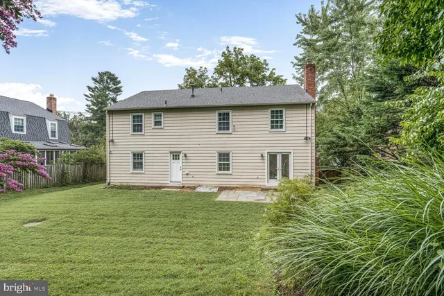 a house that has a tree in front of it