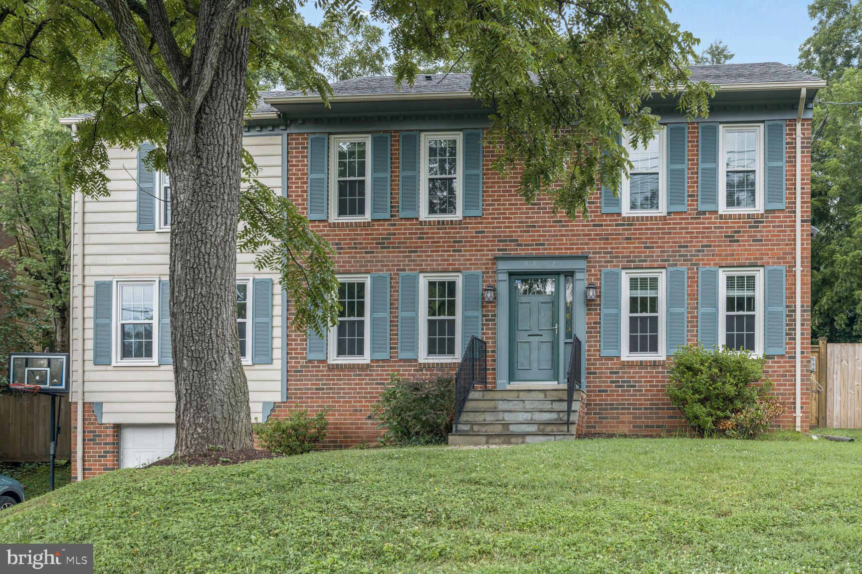 9102 Jones Mill Road Chevy Chase, MD 20815 - Photo 4 of 32 front view of a house with a yard