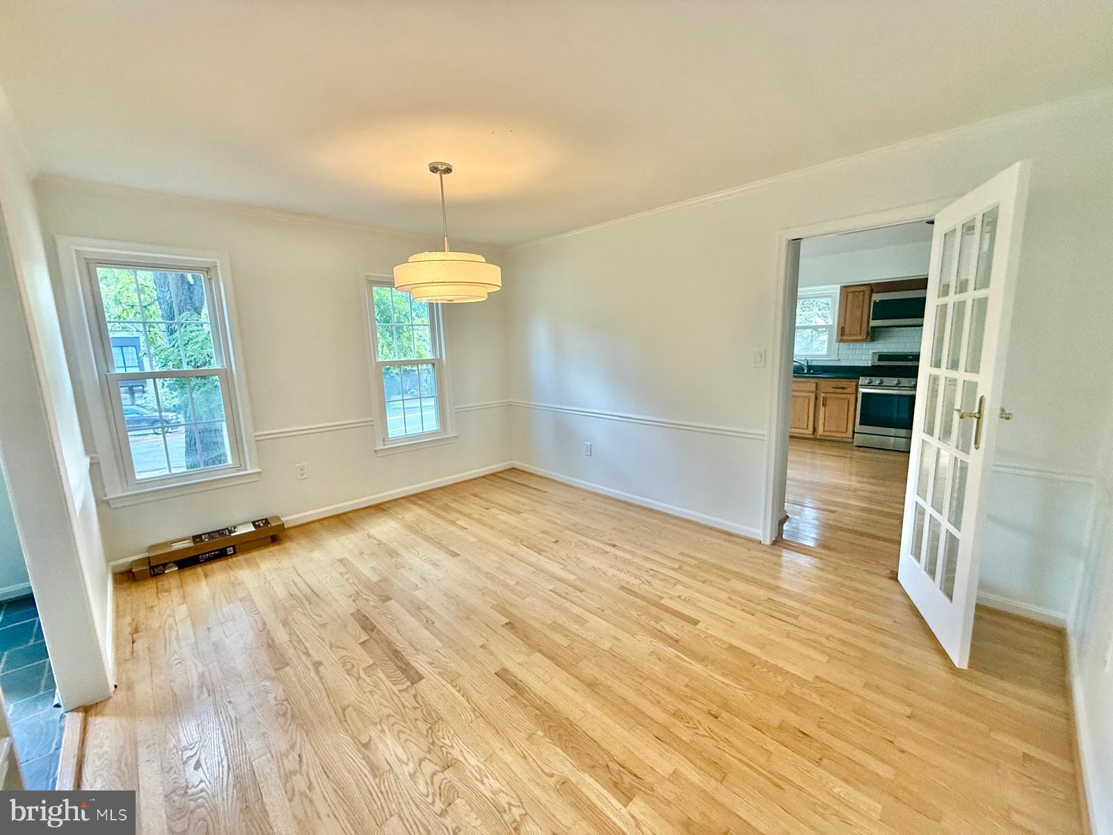 9102 Jones Mill Road Chevy Chase, MD 20815 - Photo 8 of 32 wooden floor in an empty room with a window