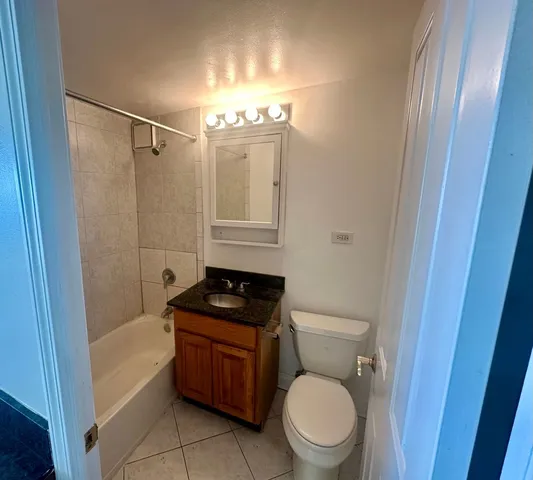 a bathroom with a toilet a sink and bathtub