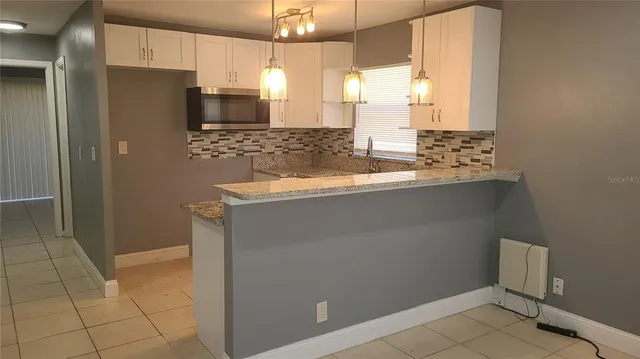 a bathroom with a sink a mirror and a shower