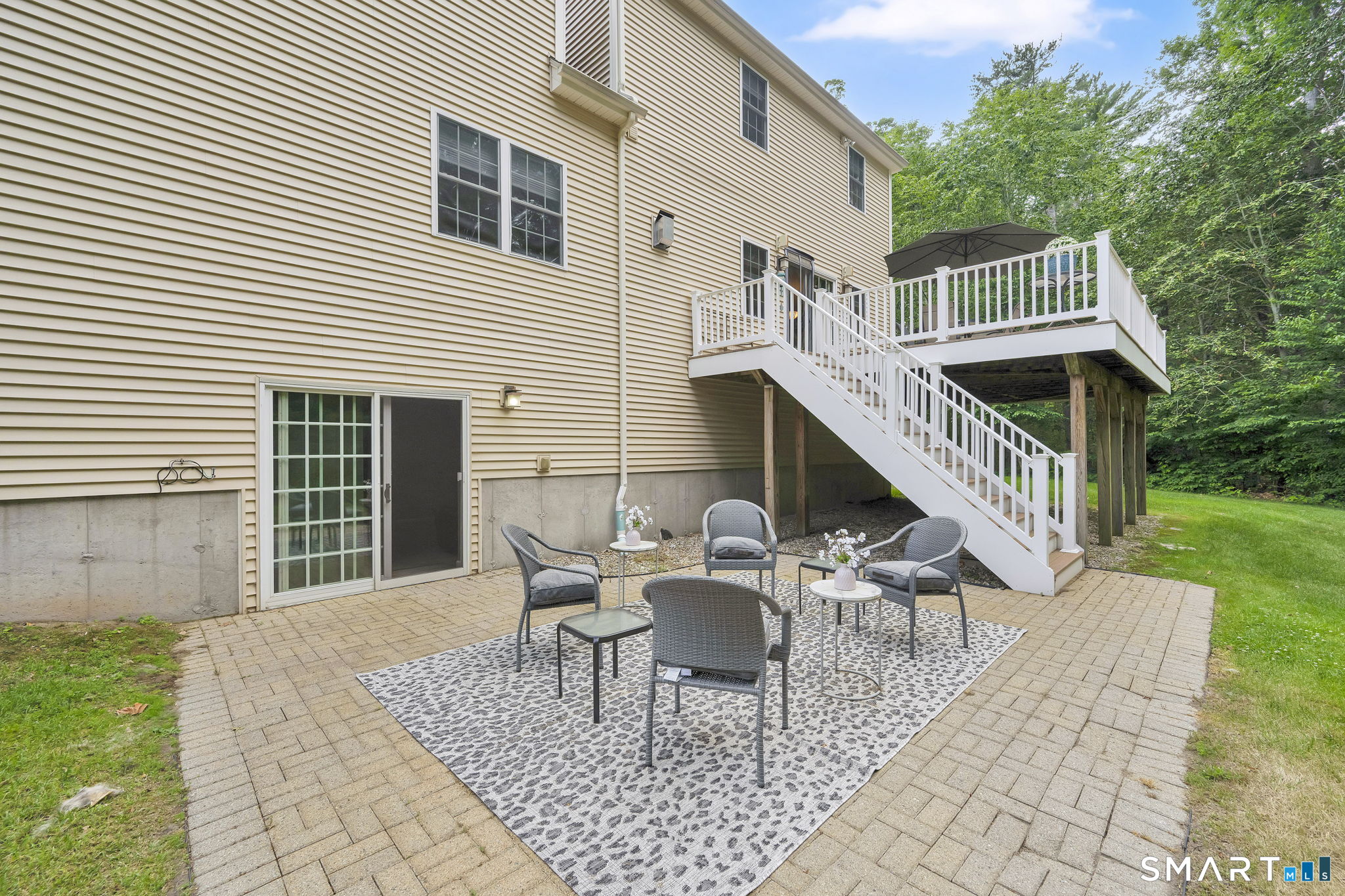 5 Edwards Way Bloomfield, CT 06002 - Photo 3 of 40 The walk-out 900 square foot finished lower level opens onto a patio, where you can enjoy the beautiful backyard.