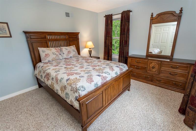 2226 County Line Road Champion, PA 15622 - Photo 24 of 33 a bedroom with a bed window and mirror