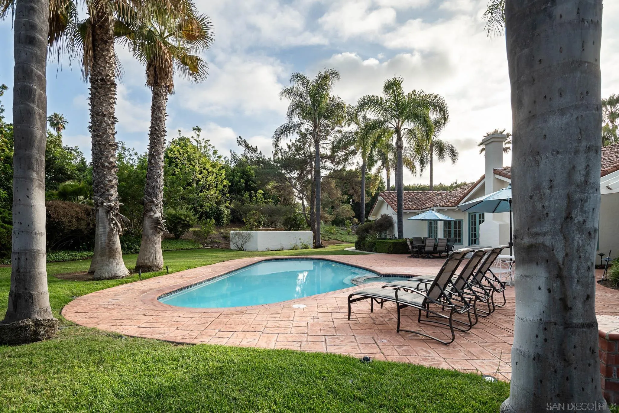 18221 Via Ascenso Rancho Santa Fe, CA 92067 - Photo 16 of 37 a swimming pool with outdoor seating and yard