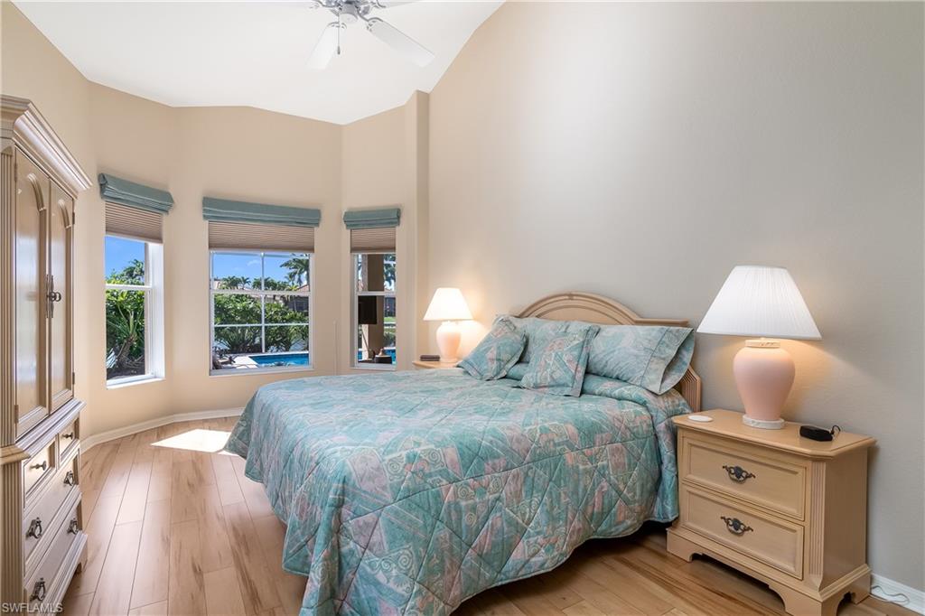 8931 Lely Island Circle Naples, FL 34113 - Photo 20 of 46 a bedroom with a bed and a window
