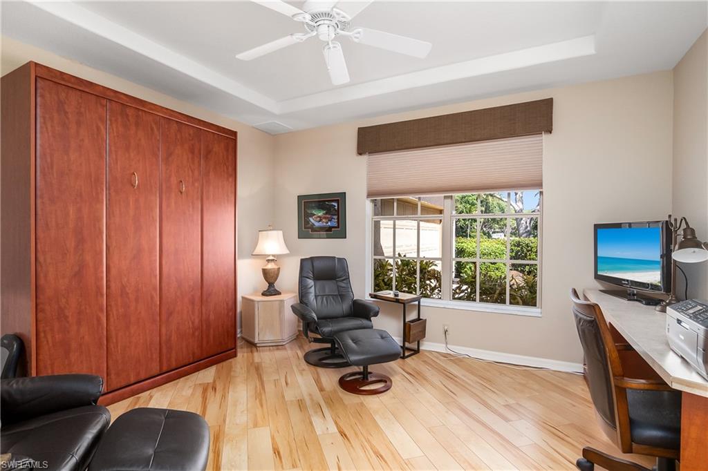 8931 Lely Island Circle Naples, FL 34113 - Photo 24 of 46 a view of a livingroom with workspace and a window
