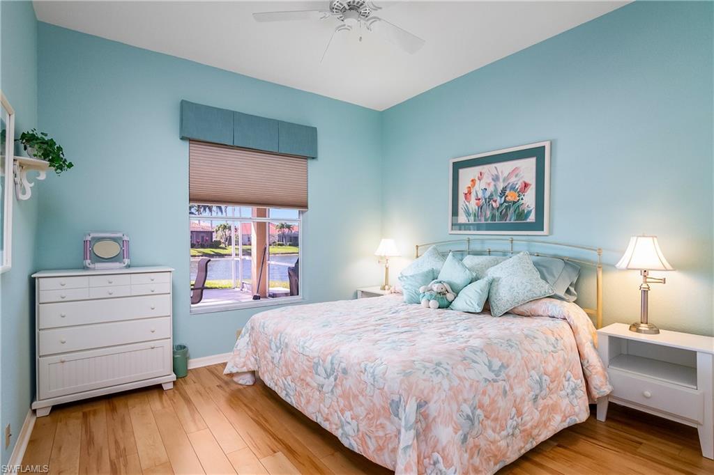 8931 Lely Island Circle Naples, FL 34113 - Photo 25 of 46 a bedroom with a bed and a dresser