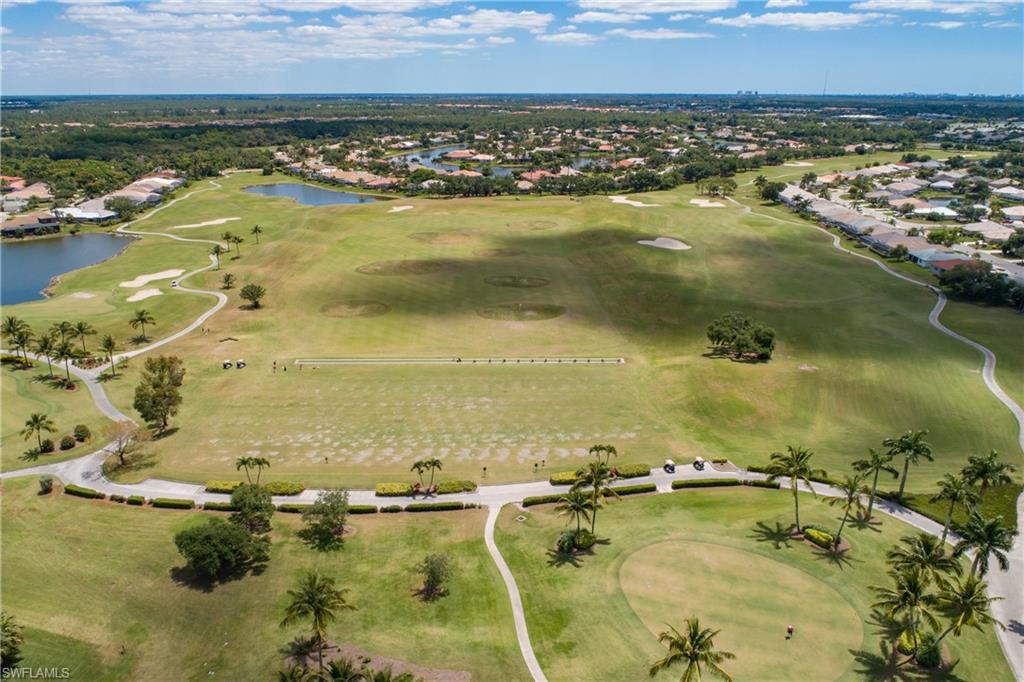 8931 Lely Island Circle Naples, FL 34113 - Photo 44 of 46 an aerial view of residential houses with outdoor space