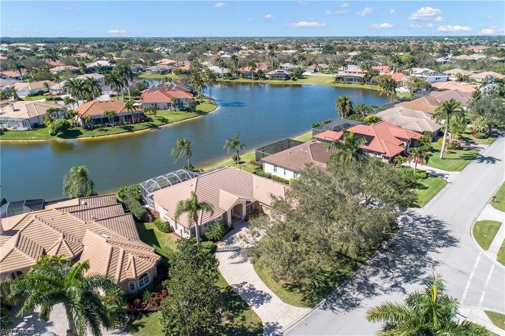 8931 Lely Island Circle Naples, FL 34113 - Photo 6 of 46 an aerial view of lake and residential houses with outdoor space