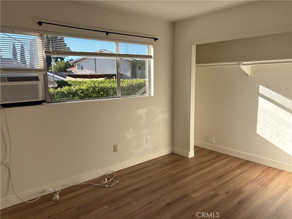 1941 Hillhaven Drive Brea, CA 92821 - Photo 11 of 30 an empty room with wooden floor and windows