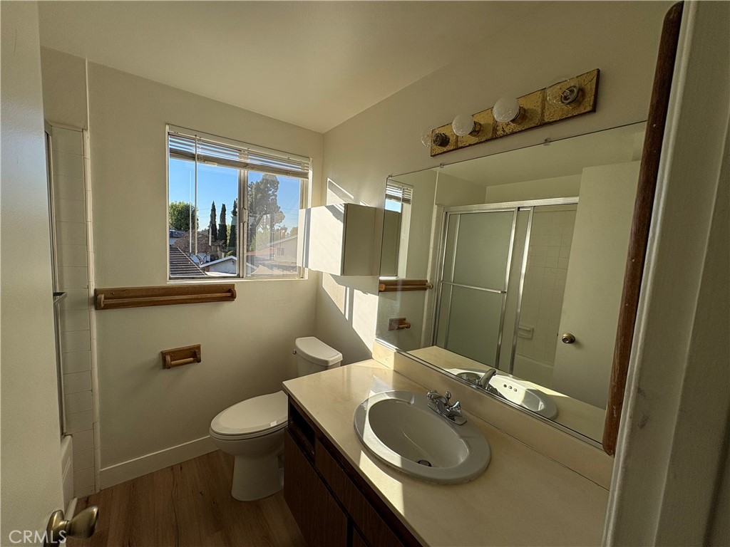 1941 Hillhaven Drive Brea, CA 92821 - Photo 22 of 30 a bathroom with a granite countertop sink a toilet a mirror and shower