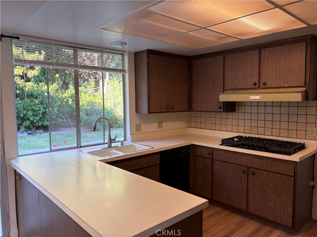 1941 Hillhaven Drive Brea, CA 92821 - Photo 4 of 30 a kitchen with a sink a stove top oven a counter space and cabinets