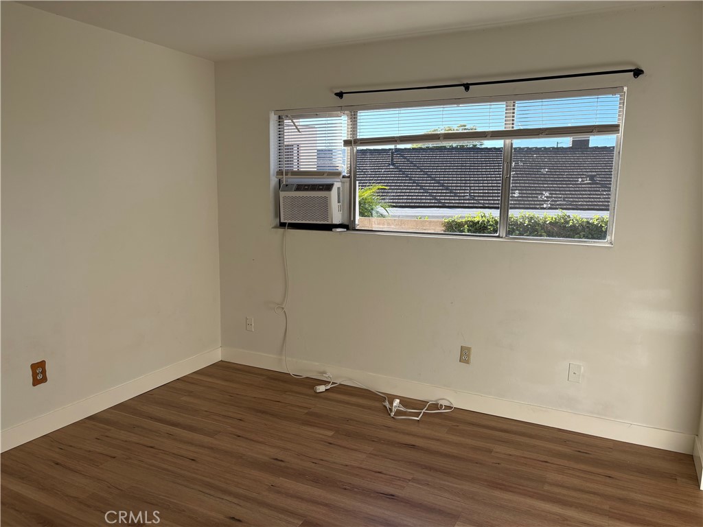1941 Hillhaven Drive Brea, CA 92821 - Photo 10 of 30 a view of empty room with wooden floor and fan