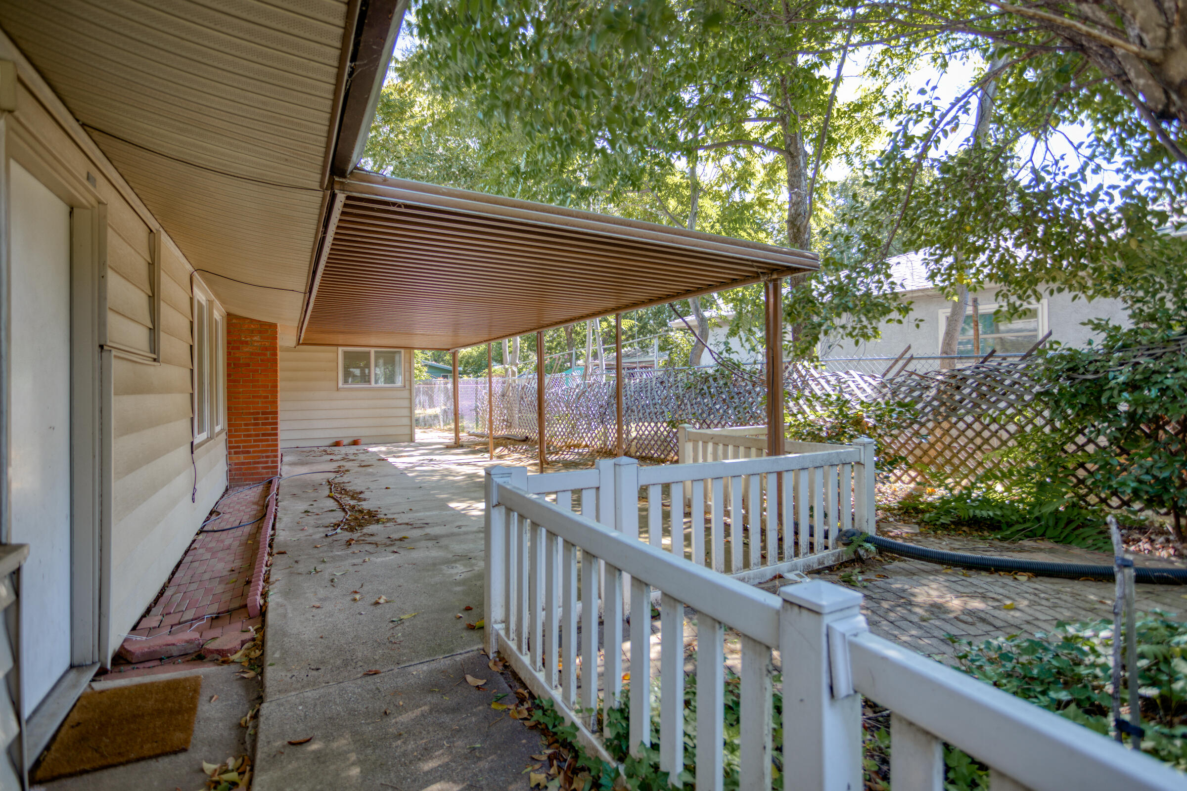 760 Locust Street Redding, CA 96001 - Photo 8 of 12 a view of deck with patio and wooden fence