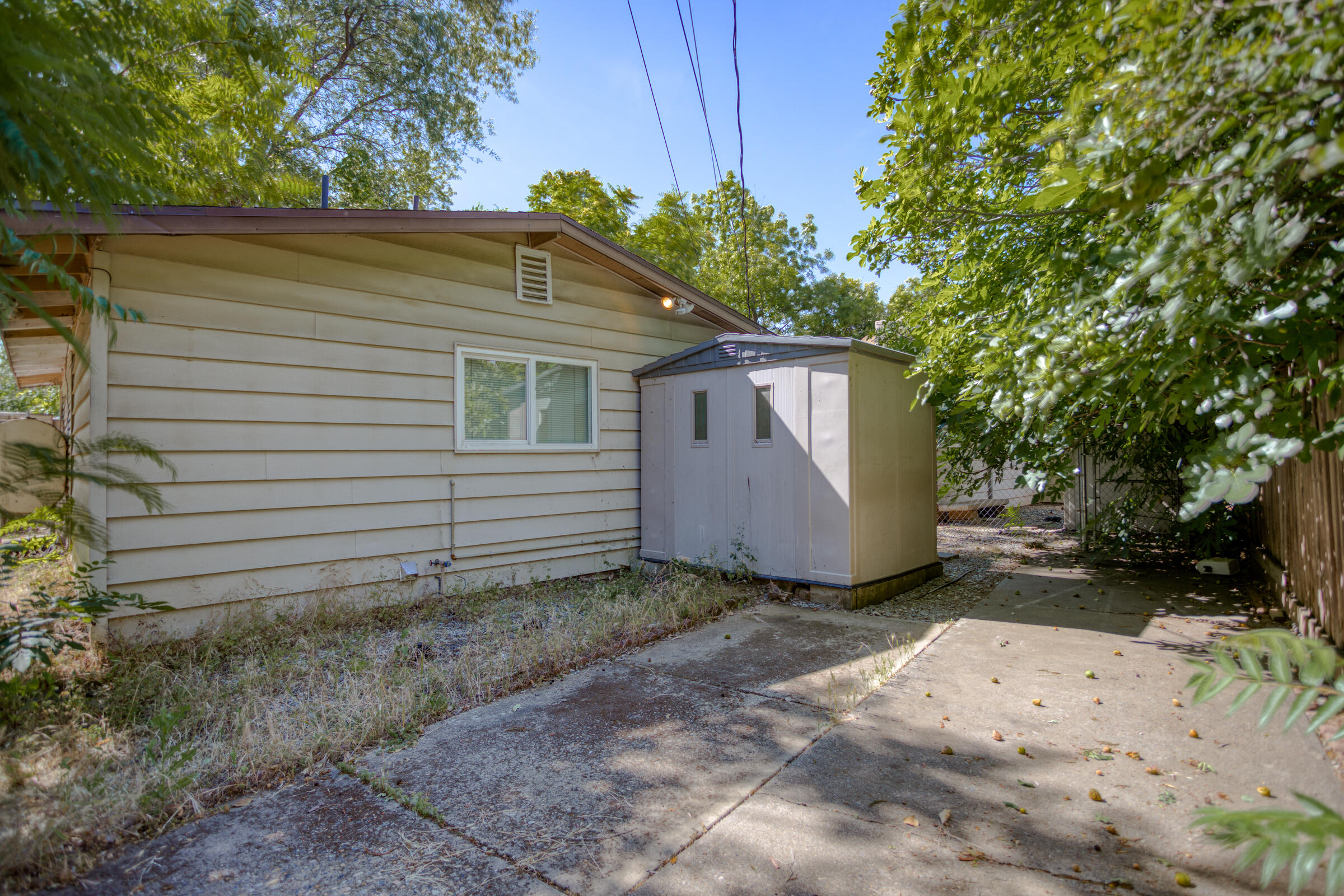 760 Locust Street Redding, CA 96001 - Photo 9 of 12 a view of a house with a yard and plants