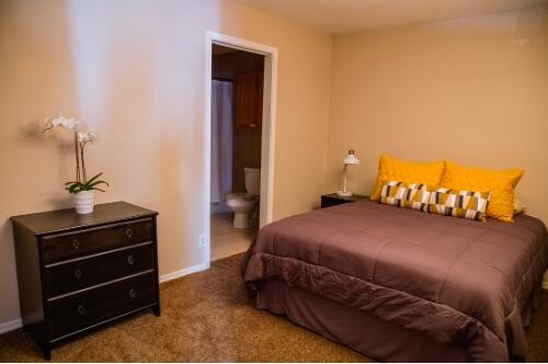 760 Locust Street Redding, CA 96001 - Photo 10 of 12 a bedroom with a bed and a dresser