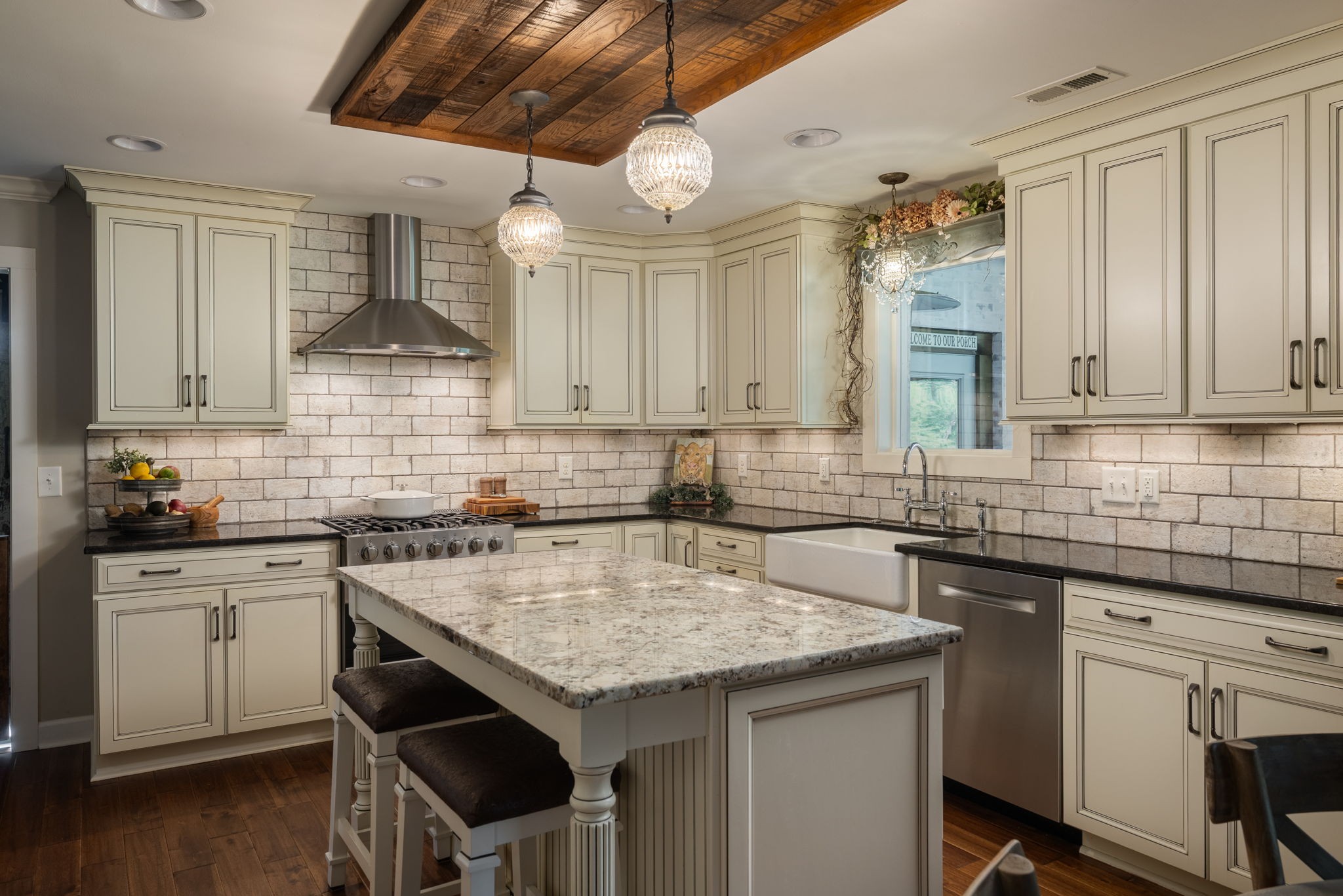 1496 Coleman Road Franklin, TN 37064 - Photo 14 of 73 a kitchen with a sink a stove cabinets and wooden floor