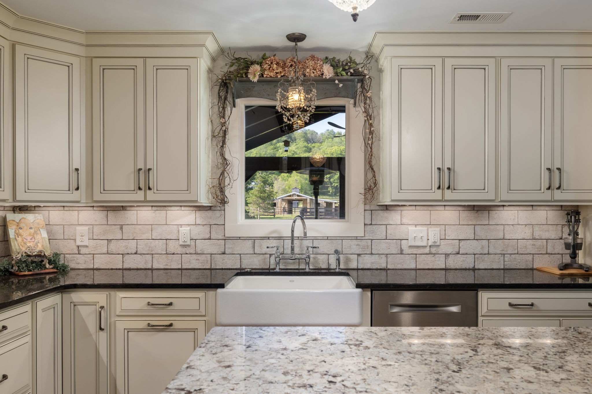 1496 Coleman Road Franklin, TN 37064 - Photo 15 of 73 a kitchen with stainless steel appliances granite countertop a sink a stove and cabinets